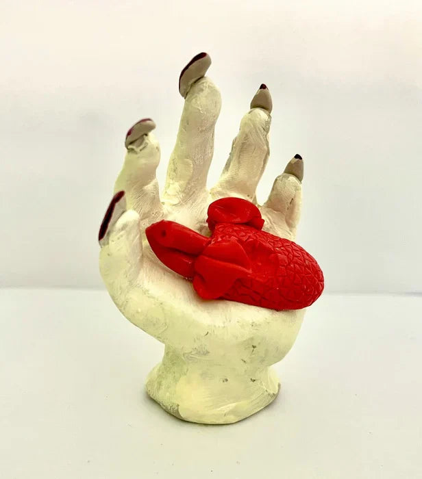 Heart in Hand, Bettina Homann, 2025, ceramics, 3 x 2.5 in. / 7.62 x 6.35 cm.
