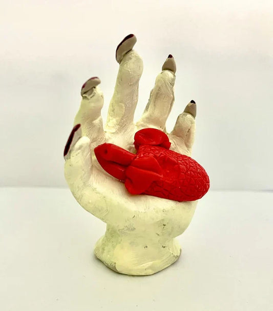 Heart in Hand, Bettina Homann, 2025, ceramics, 3 x 2.5 in. / 7.62 x 6.35 cm.