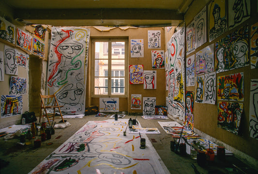 small drawings and large artworks fill artists studio