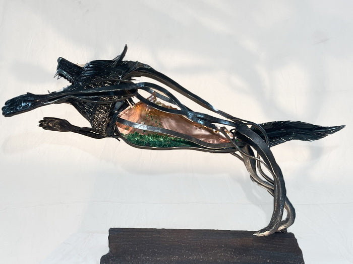 Indigo "Ferrous Lupus", 2023, blacksmithing, 32 x 49 x 16 in. / 81.28 x 124.46 x 40.64 cm.