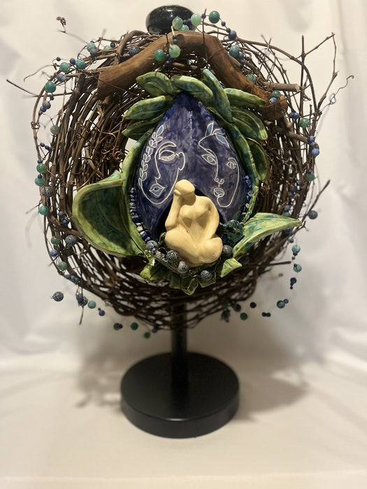 Retreating to My World Within the World, 2025, mixed media, 20 x 12 x 7 in. / 50.8 x 30.48 x 17.78cm.