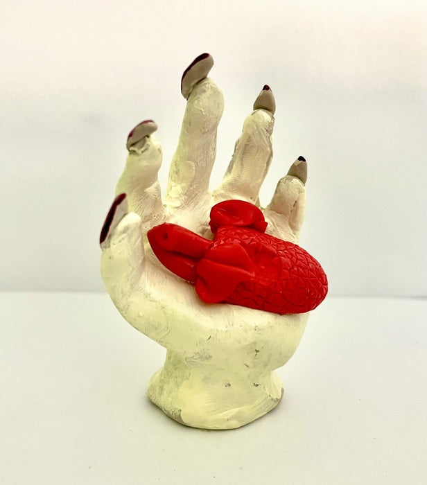 Heart in Hand, 2025, ceramics, 3 x 2.5 in. / 7.62 x 6.35 cm.