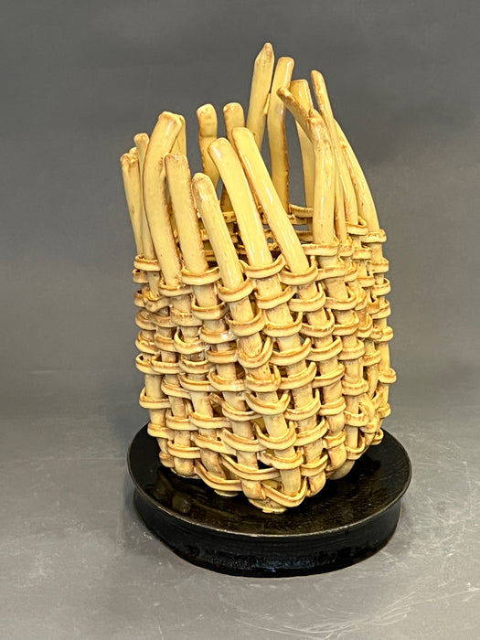 Basket of Ebb and Flow, 2025, ceramics, 14 x 10 x 10 in. / 35.56 x 25.4 x 25.4 cm.