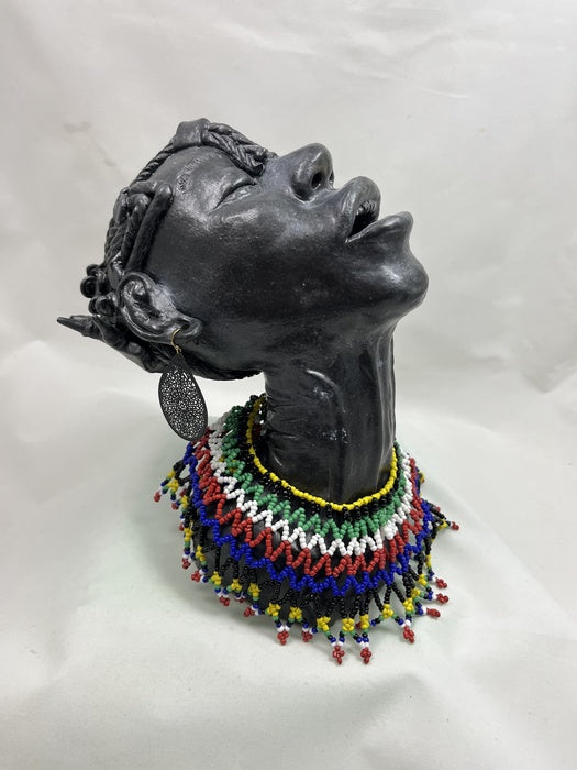 Let Go, 2025, clay and jewelry, 9.5 x 7 x 10.5 in. / 24.13 x 17.78 x 26.67 cm.