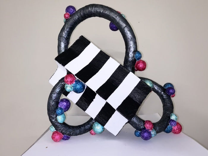 Child’s Play, 2025, mixed media, 24 x 23 x 15 in. / 60.96 x 58.42 x 38.1 cm.