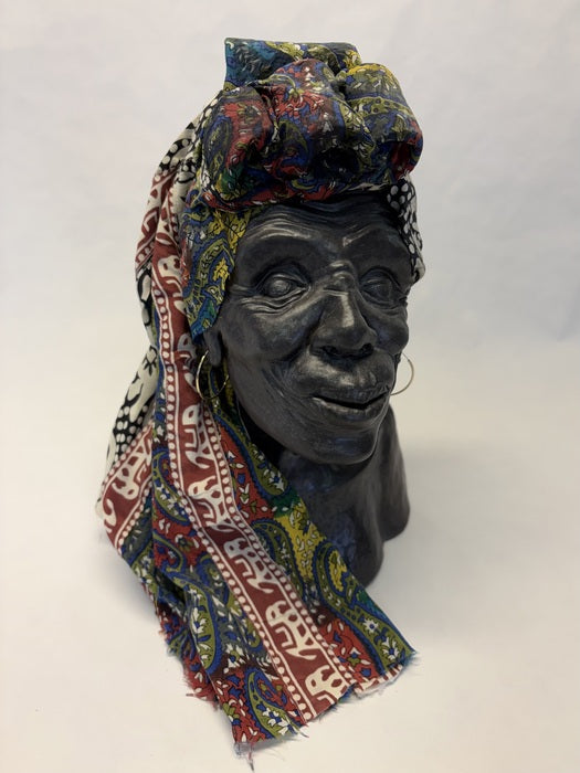 Nyanya (Swahili for Grandmother), 2025, mixed media, 12 x 11 x 7.25 in. / 30.48 x 27.94 x 18.41 cm.