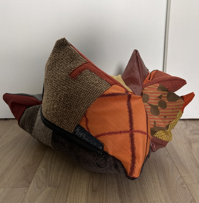 Spike, 2026, upcycled fabric and upholstery samples, 21 x 12 x 14 in. / 53.34 x 30.48 x 35.56 cm.