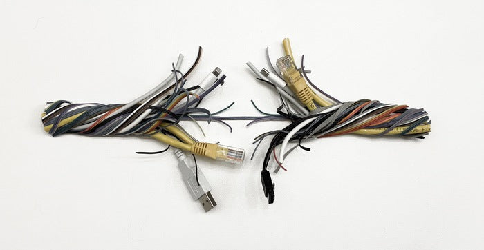 Digital Breaking Point, 2026, recycled electric wires on circuit board, 5 x 11 in. / 12.7 x 27.94 cm.