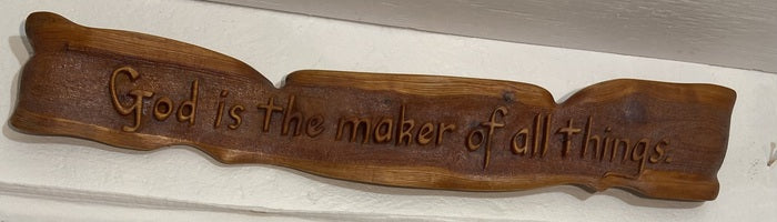 All Praise to our Creator, 2023, wood, 5 x 35 x 2 in. / 12.7 x 88.9 x 5.08 cm.