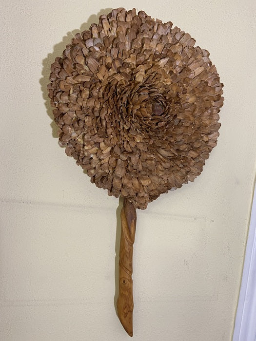 City Flower, 2021, wood chips, 33 x 17 in. / 83.82 x 43.18 cm.