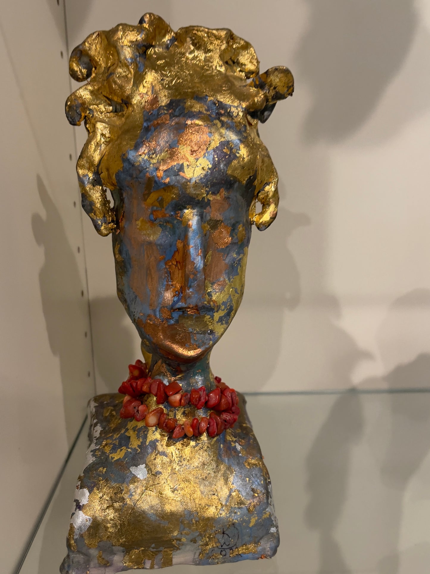 Golden Divinity, 2024, clay and beads, 10 x 6 x 4 in. / 25.4 x 15.24 x 10.16 cm.