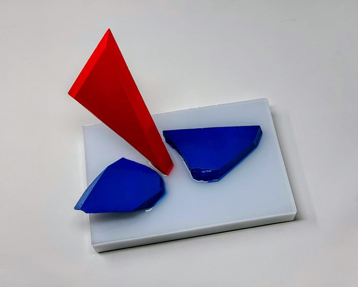 Red, White and Shattered Blue, 2024, resin, 9 x 9 x 6 in. / 22.86 x 22.86 x 15.24 cm.