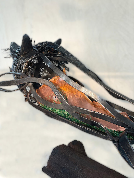 Indigo "Ferrous Lupus", 2023, blacksmithing, 32 x 49 x 16 in. / 81.28 x 124.46 x 40.64 cm.