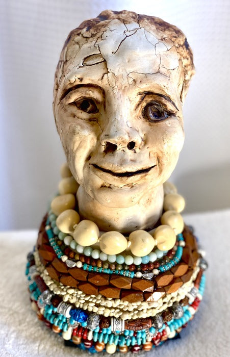 Beaded Woman, 2022, ceramic and mixed media, 13 x 8 x 8 in. / 33.02 x 20.32 x 20.32 cm.