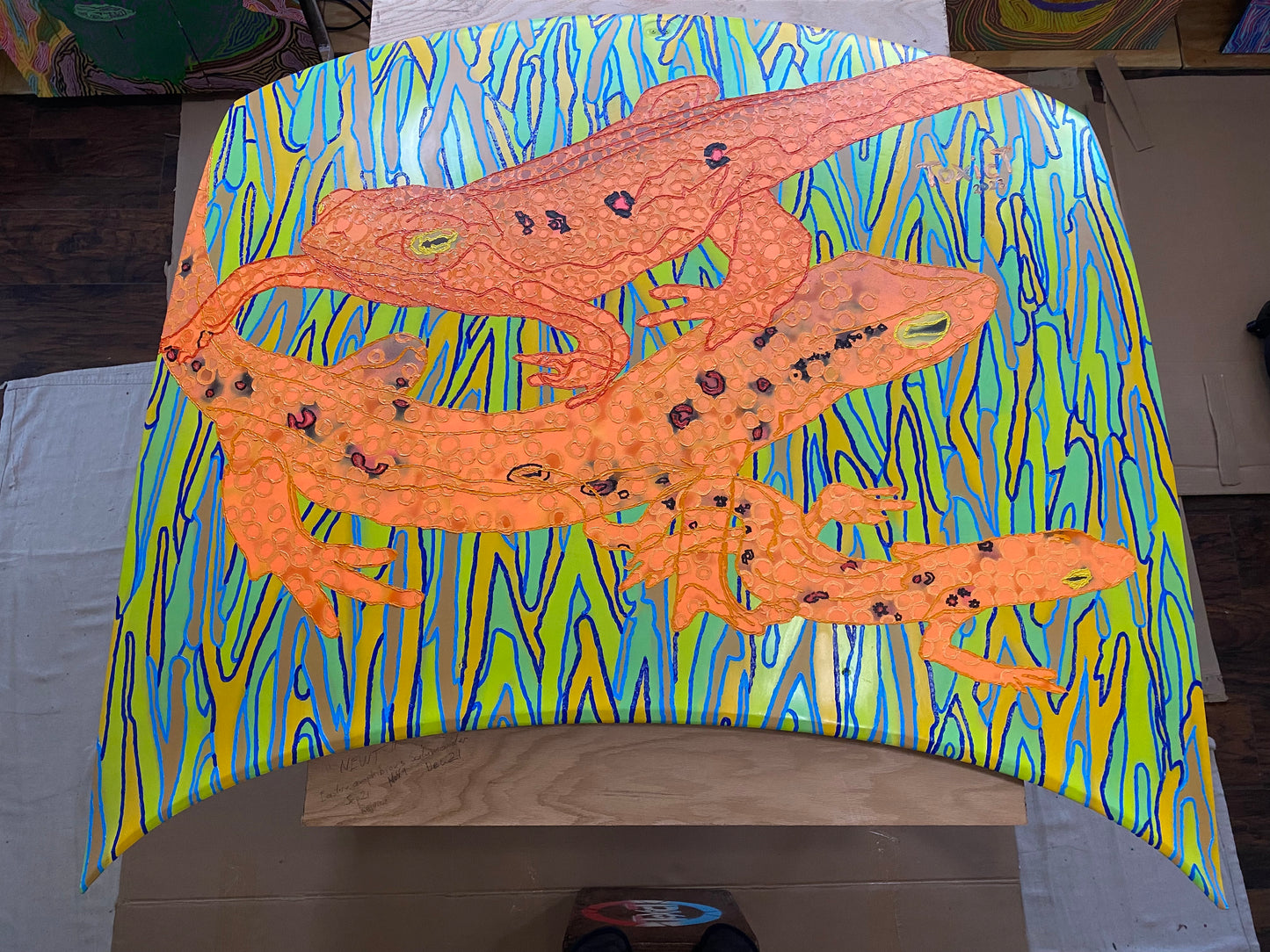 Newts, 2024, spray paint & oil paint on car hood, 63 x 55 in. / 160.02 x 139.7 cm.
