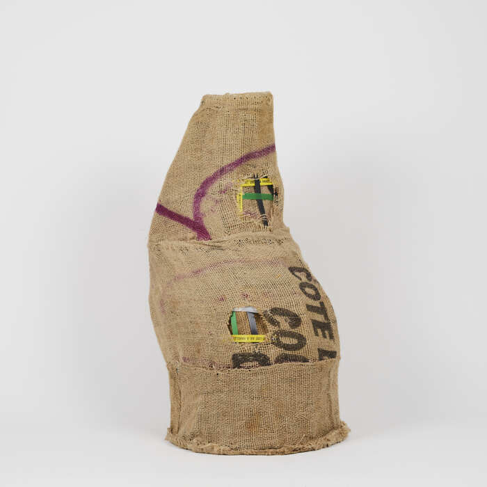 Migrant Mark III, Ezekiel Martey, 2024, mixed media, 24 x 13 x 13 in. / 60.96 x 33.02 x 33.02 cm.