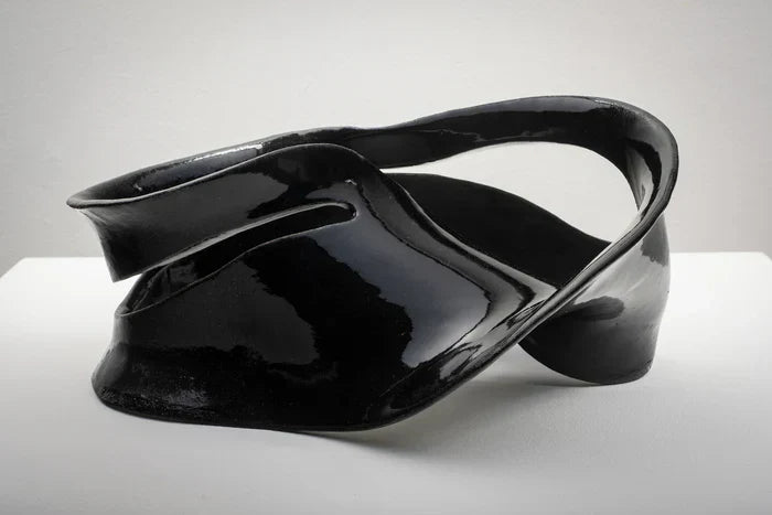 Möbius Strip Variation I, Julia Zhang, 2025, ceramics, 9 x 13.5 x 8 in. / 22.86 x 34.29 x 20.32 cm.
