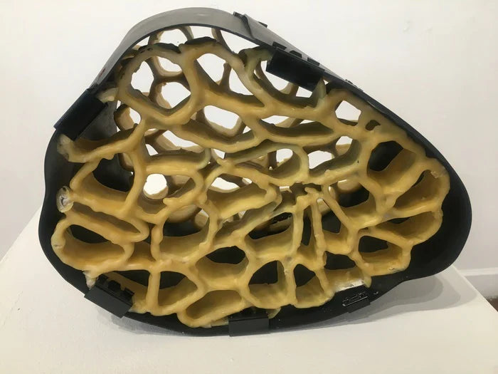Honeycomb and Black Rubber Structures, Elsabe Dixon, 2023, beeswax and black rubber, 15 x 12 x 10 in. / 38.1 x 30.48 x 25.4 cm.