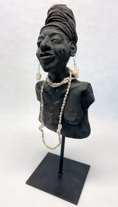 Breast Cancer Triumph, Lynda Filbert, 2025, clay sculpture, 8 x 5 x 5 in. / 20.32 x 12.7 x 12.7 cm.