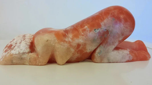Orange Bloom, Michelle Frazier, 2023, translucent orange alabaster, 3.5 x 11.25 x 4 in. / 8.89 x 28.5 x 10.16 cm.