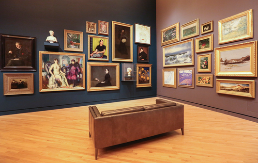 an art dealer displays his art collection in his viewing corner