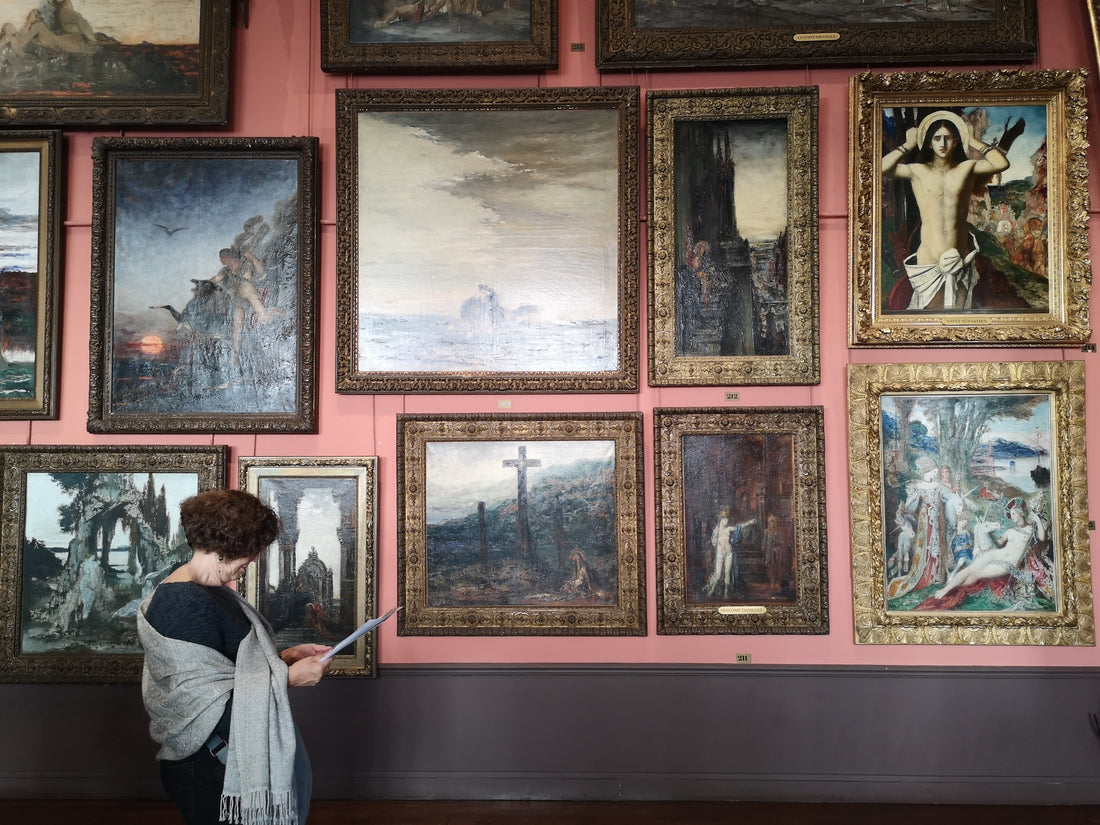 a woman catalogs her private collection of art she bought as an investment