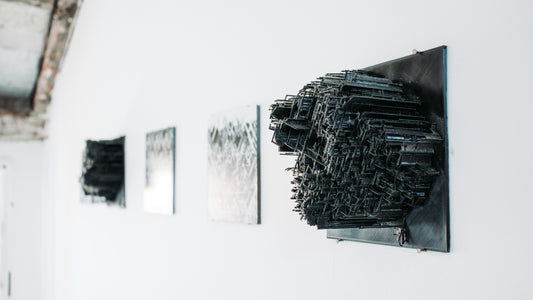 modern sculpture artworks hang on wall