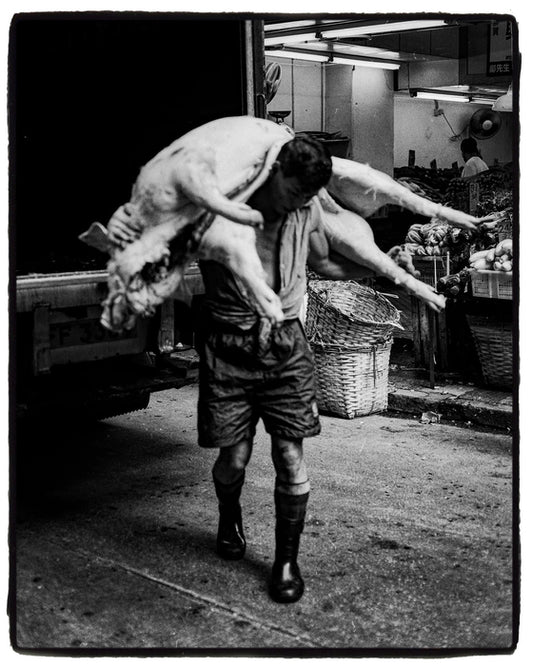Man Carrying Carcass, China, 1997, pigment, 20 x 16 in. / 50.8 x 40.64 cm.