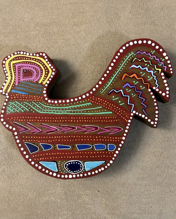 Huichol-Inspired Chicken, 2024, acrylic on found object, 7 x 7 in. / 17.78 x 17.78 cm.