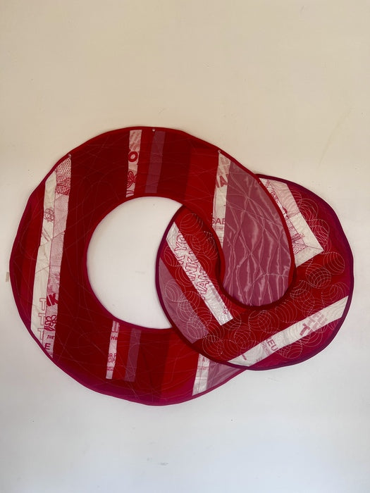 Circles, 2024, fabric and plastic, 3 x 4 in. / 7.62 x 10.16 cm.