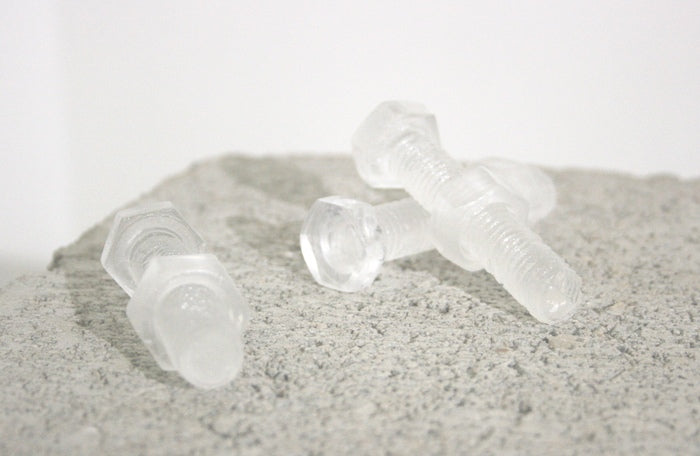 Nuts and Bolts, 2024, kiln casted glass, 4 x .75 in. / 10.16 x 1.90 cm.