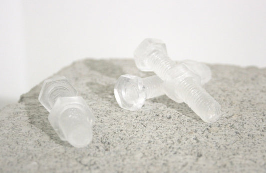 Nuts and Bolts, 2024, kiln casted glass, 4 x .75 in. / 10.16 x 1.90 cm.