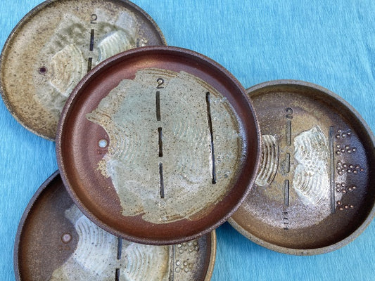 Double Slit Experiment, 2024, woodfired ceramic, 1.5 x 9 x 9 in. / 3.81 x 22.86 x 22.86 cm.