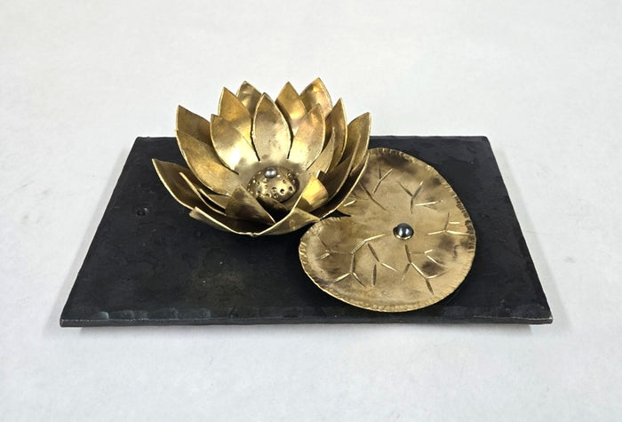 Golden Lotus, 2024, brass and steel, 2 x 8.5 x 5 in. / 5.08 x 21.59 x 12.7 cm.