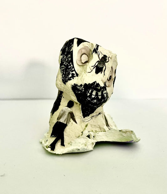Blackie, 2025, paper mâché, 4 x 2 x 2 in. / 10.16 x 5.08 x 5.08 cm.