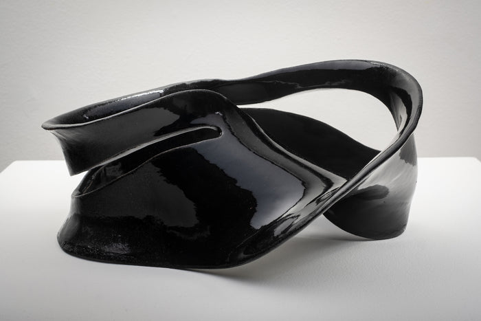 Möbius Strip Variation I, 2025, ceramics, 9 x 13.5 x 8 in. / 22.86 x 34.29 x 20.32 cm.