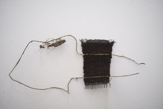 Weaving 1, 2025, wool, yarn and vines, 15 x 5 in. / 38.1 x 12.7 cm.