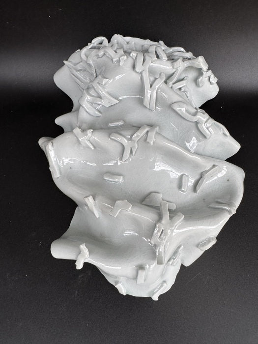 Iced Topography, 2025, porcelain, 12 x 9 x 3 in. / 30.48 x 22.86 x 7.62 cm.