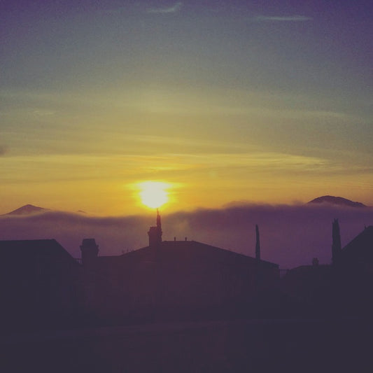 Sunset Over Rooftops, 2025, photography, 24 x 24 in. / 60.96 x 60.96 cm.