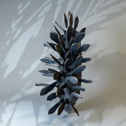 Echoed Husk, 2025, mixed media, 5 x 2.5 in. / 12.7 x 6.35 cm.