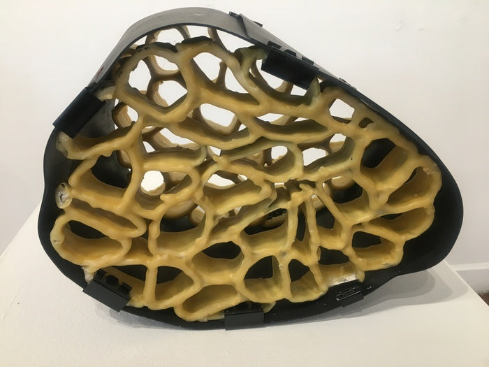 Honeycomb and Black Rubber Structures, 2023, beeswax and black rubber, 15 x 12 x 10 in. / 38.1 x 30.48 x 25.4 cm.