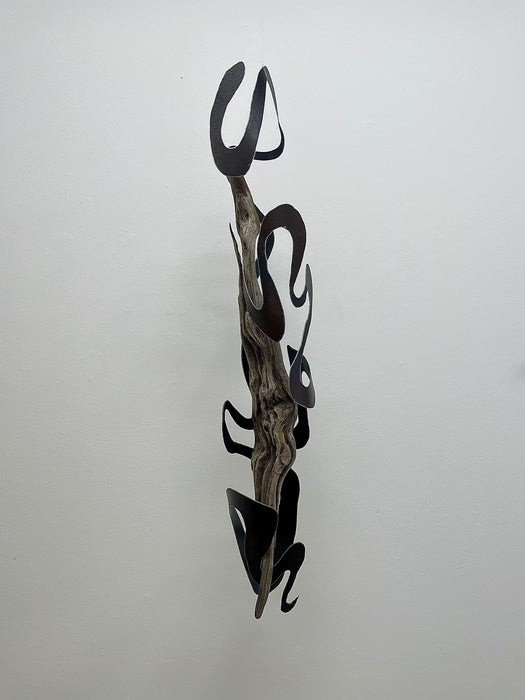 Flow, 2023, steel & driftwood, 38.5 x 6 x 8 in. / 97.79 x 15.24 x 20.32 cm.