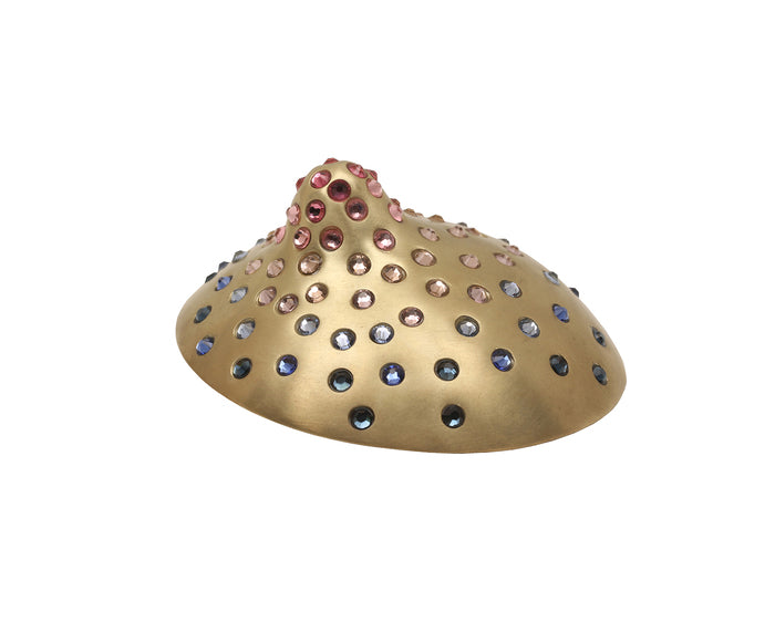 Ce N'est Pas Un Sein (They/Them), 2024, brass, steel and rhinestones, 2.5 x 2.5 in. / 6.35 x 6.35 cm.