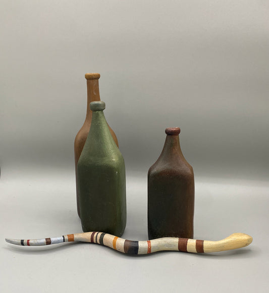 Still Life with Snake, 2021, carved and painted basswood, 8 x 13 x 6 in. / 20.32 x 33.02 x 15.24 cm.