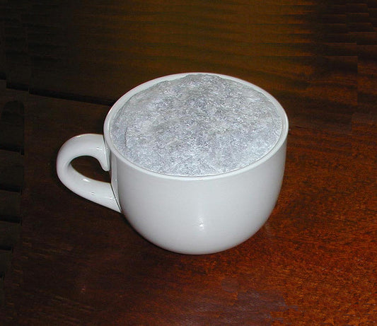 At Breakfast, 2002, mug and marble, 9 x 16 x 12 cm. / 3.5 x 6.2 x 4.7 in.