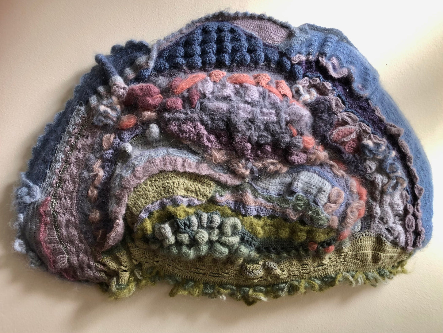 Big Sky Slip of Earth, 2025, crochet, 20 x 16 in. / 50.8 x 40.64 cm.