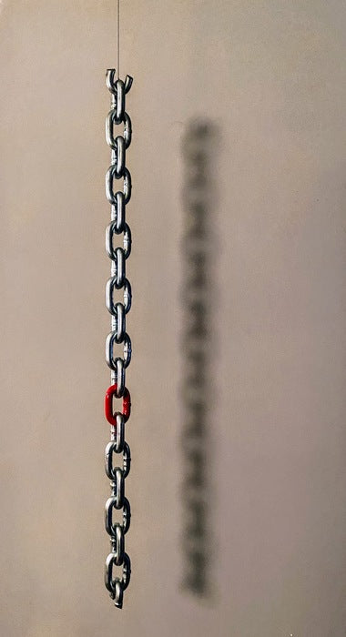 Maverick, 2022, steel chain 26" long with one link inked in red, 26 x 1 in. / 66.04 x 2.54 cm.