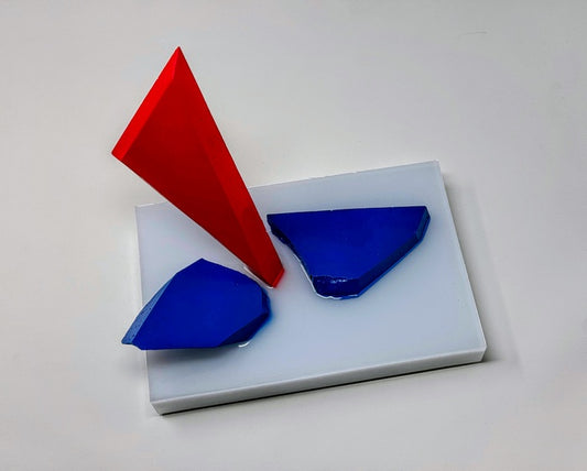 Red, White and Shattered Blue, 2024, resin, 9 x 9 x 6 in. / 22.86 x 22.86 x 15.24 cm.