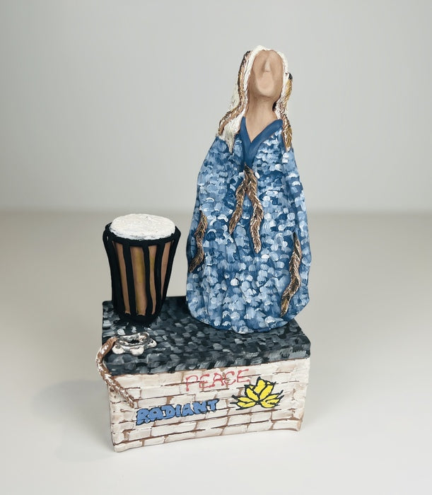 Woman Who Rocks Conga, 2023, ceramic, 11 x 5.5 in. / 27.94 x 13.97 cm.