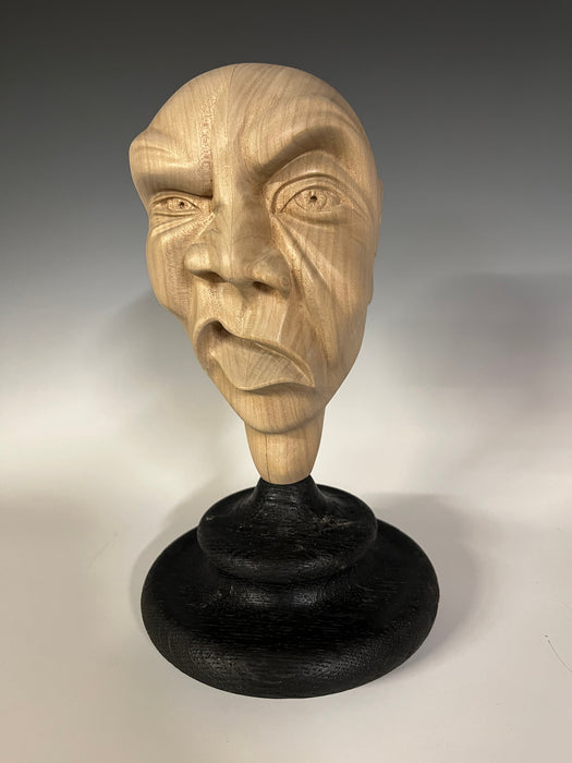 Disgruntled, 2023, wood, 11 x 6 x 6 in. / 27.94 x 15.24 x 15.24 cm.